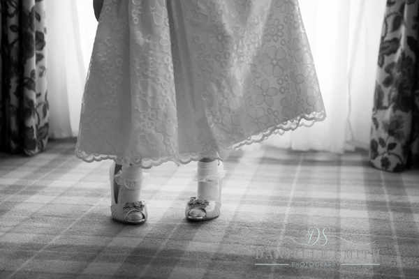 flower girl wearing brides shoes at down hall