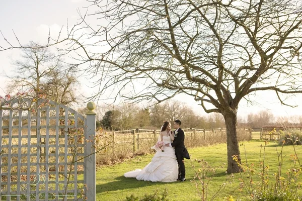 bride and groom in gardens at fennes wedding