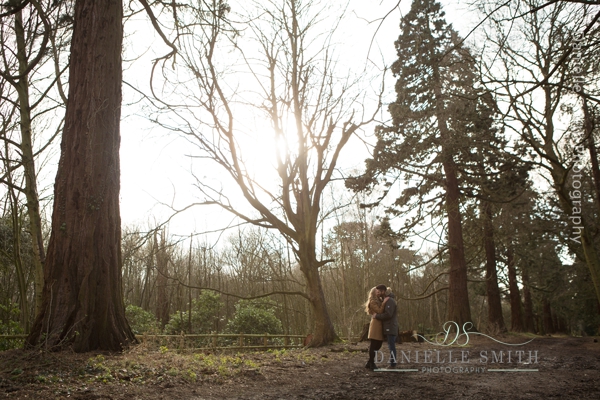 couple kissing in woods