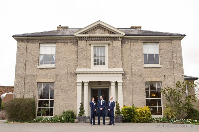 groom and groomsmen outside Fennes