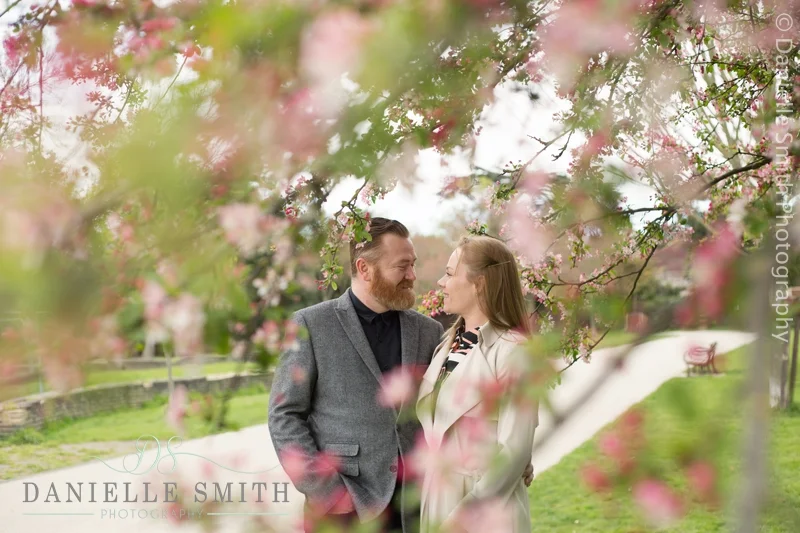 couple with blossom in raphaels park