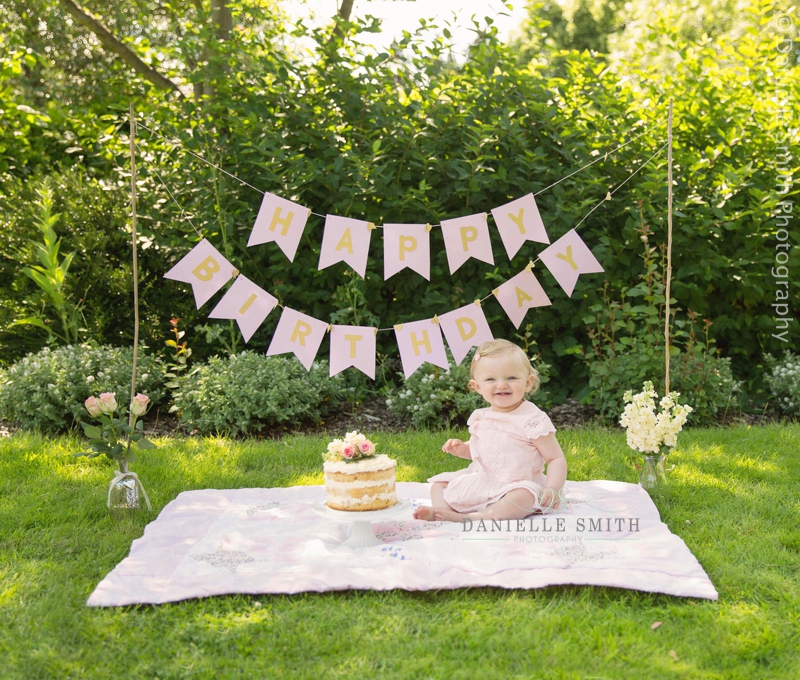 girl sitting next to naked cake - cake smash chelmsford