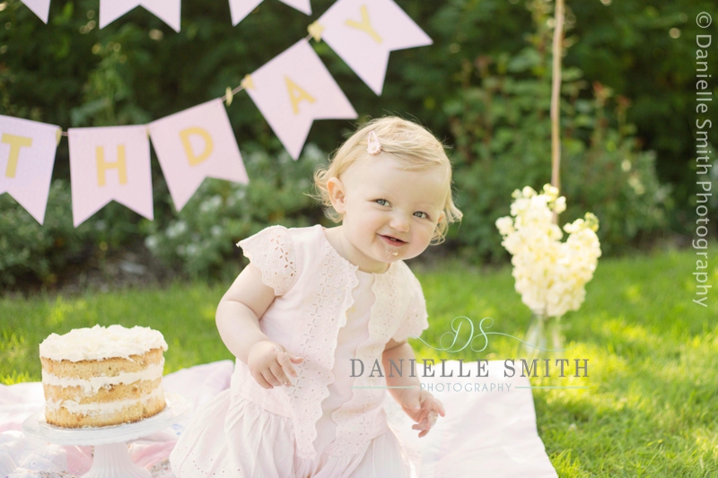 little girl dancing at outdoor cakesmash