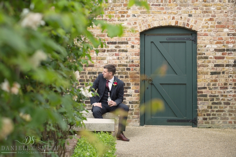 groom sitting having a beer in the garden
