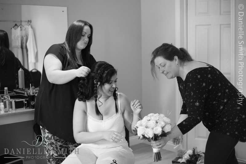 bride looking at her wedding flowers