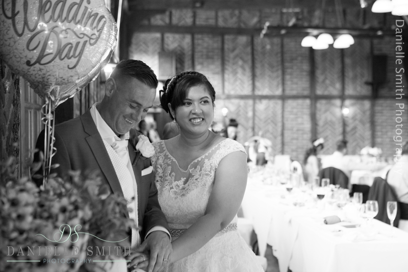 bride and groom cutting the cake