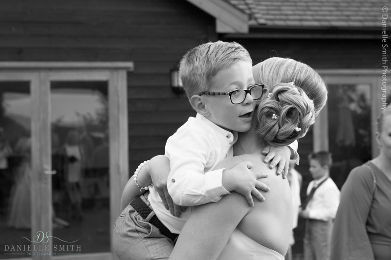 bride cuddling page boy