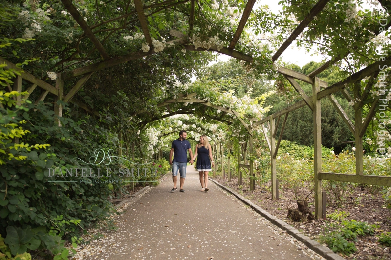 couple waling under pergola in southend