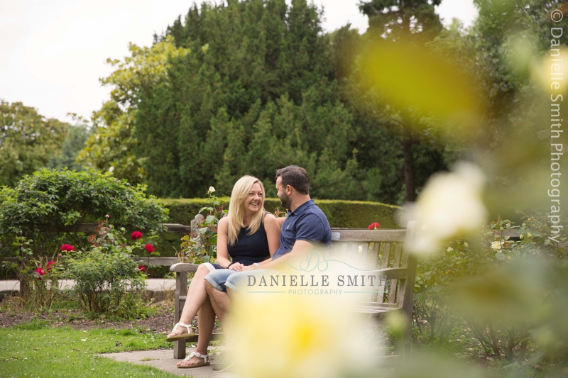 couple laughing on bench - pre-wedding photography southend