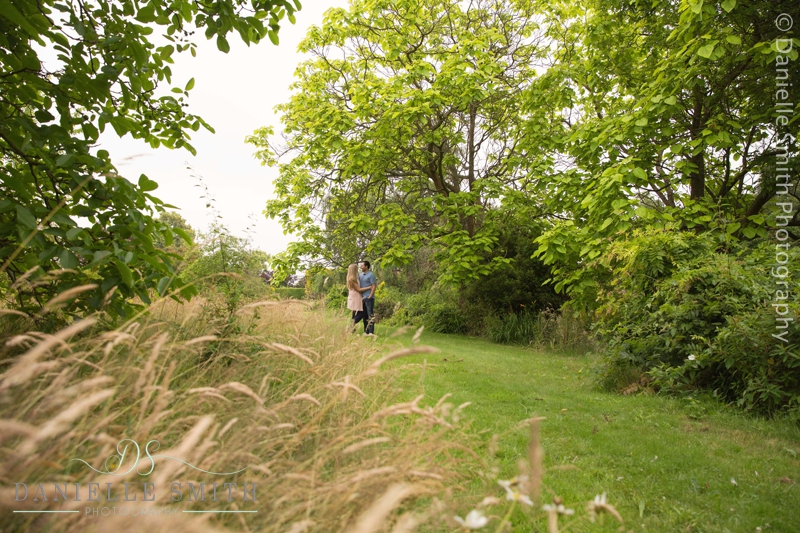 couple walking through gardens