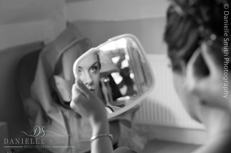 bride looking in mirror