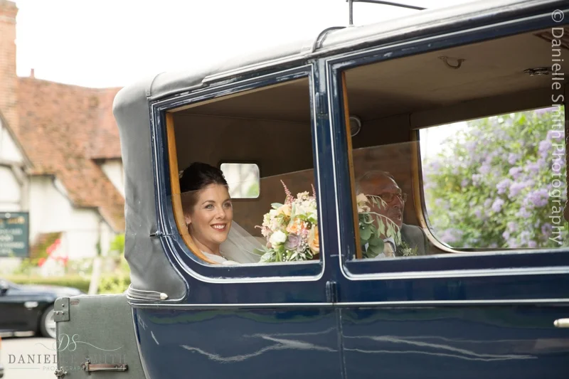 bride arriving in vintage car