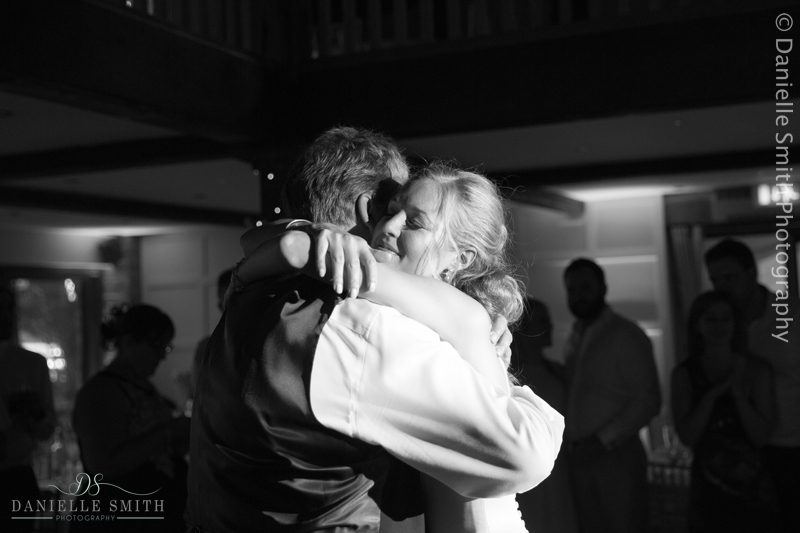 bride hugging her dad on dance floor