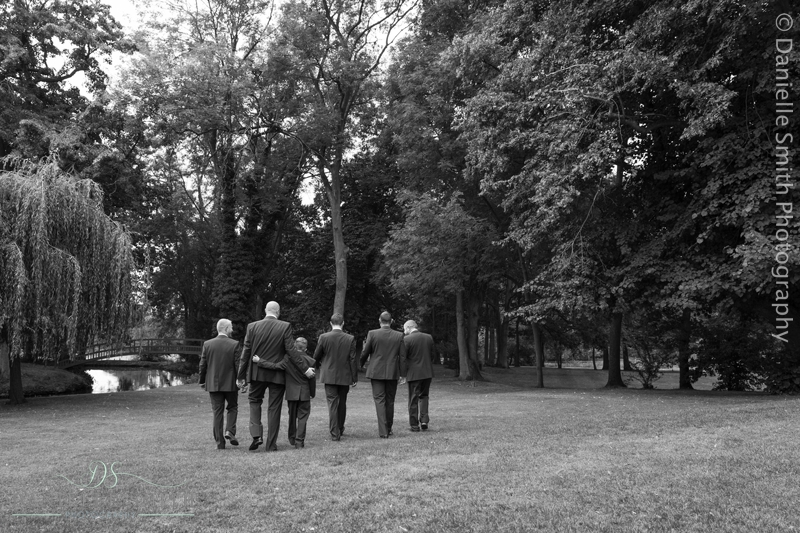 groom and son and groomsmen walking away