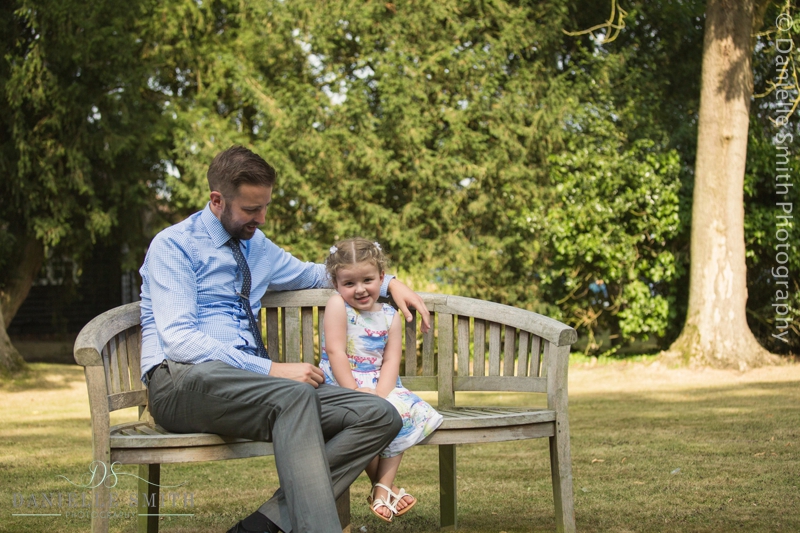 father and daughter sitting on bench - mulberry house wedding