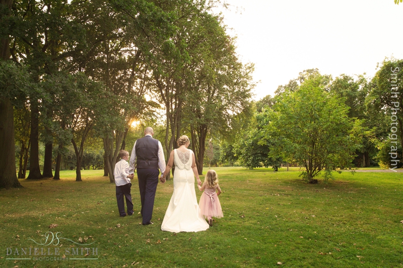 bride and groom and their children