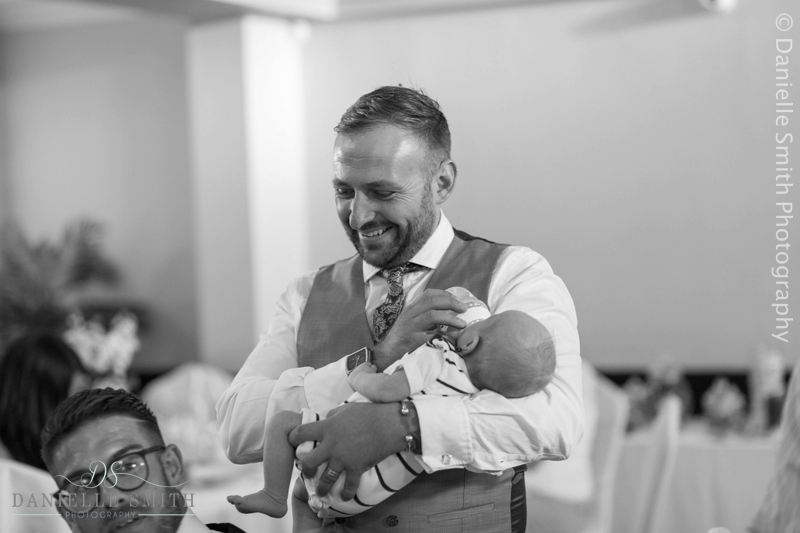 wedding guests feeding baby