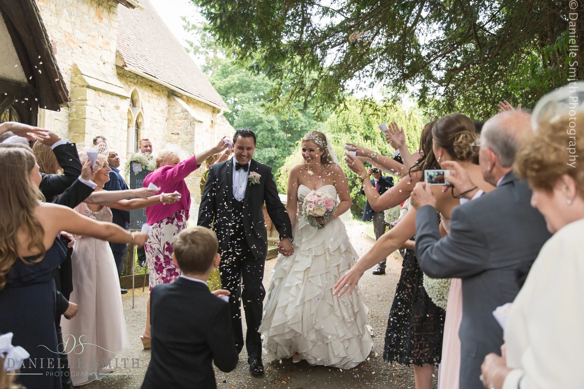 bride and groom confetti photo at Hever church