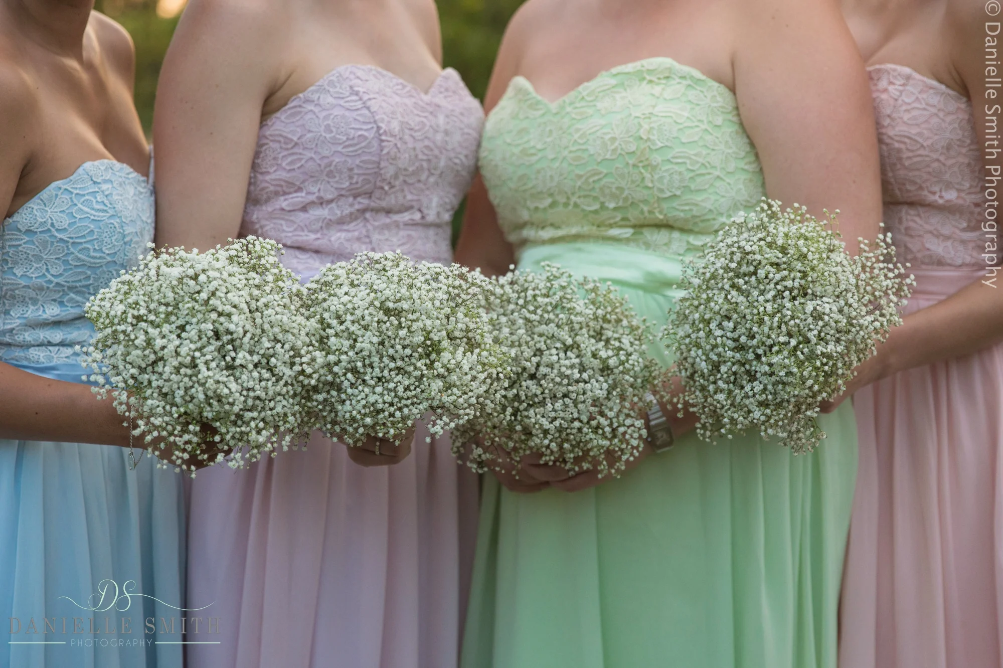 pastel bridesmaids dresses and babys breath bouquets