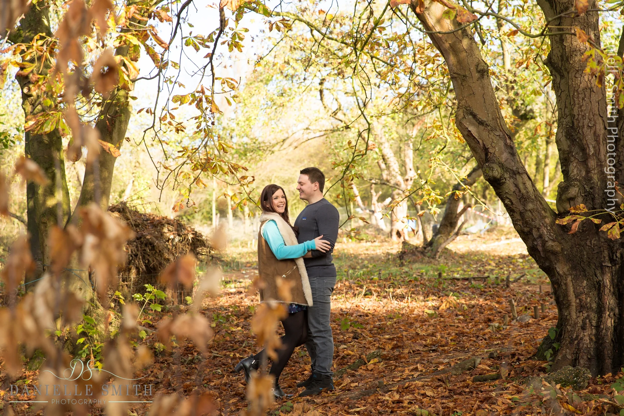 couple in autumn woodland