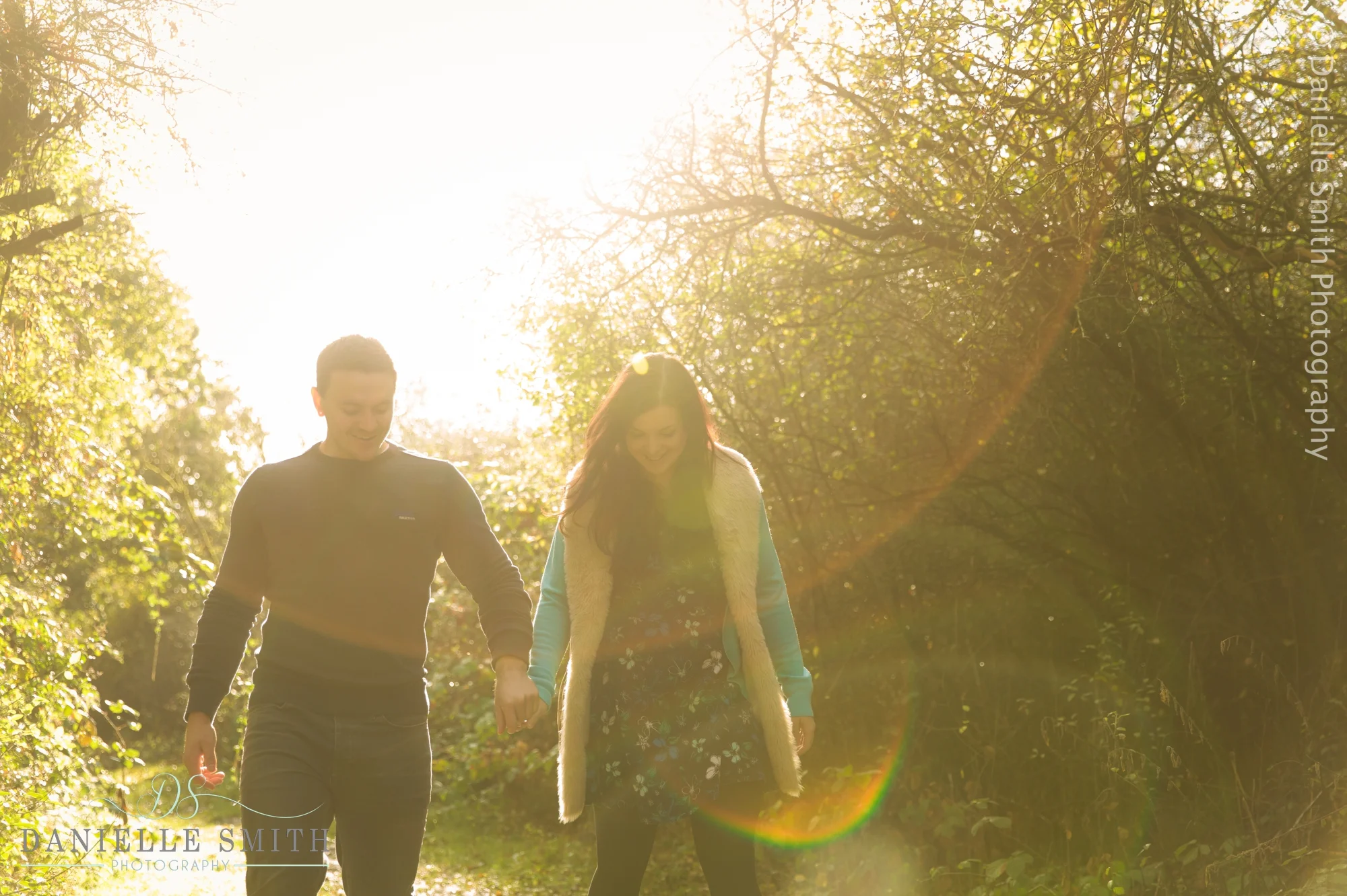 couple walking and smiling in sunset