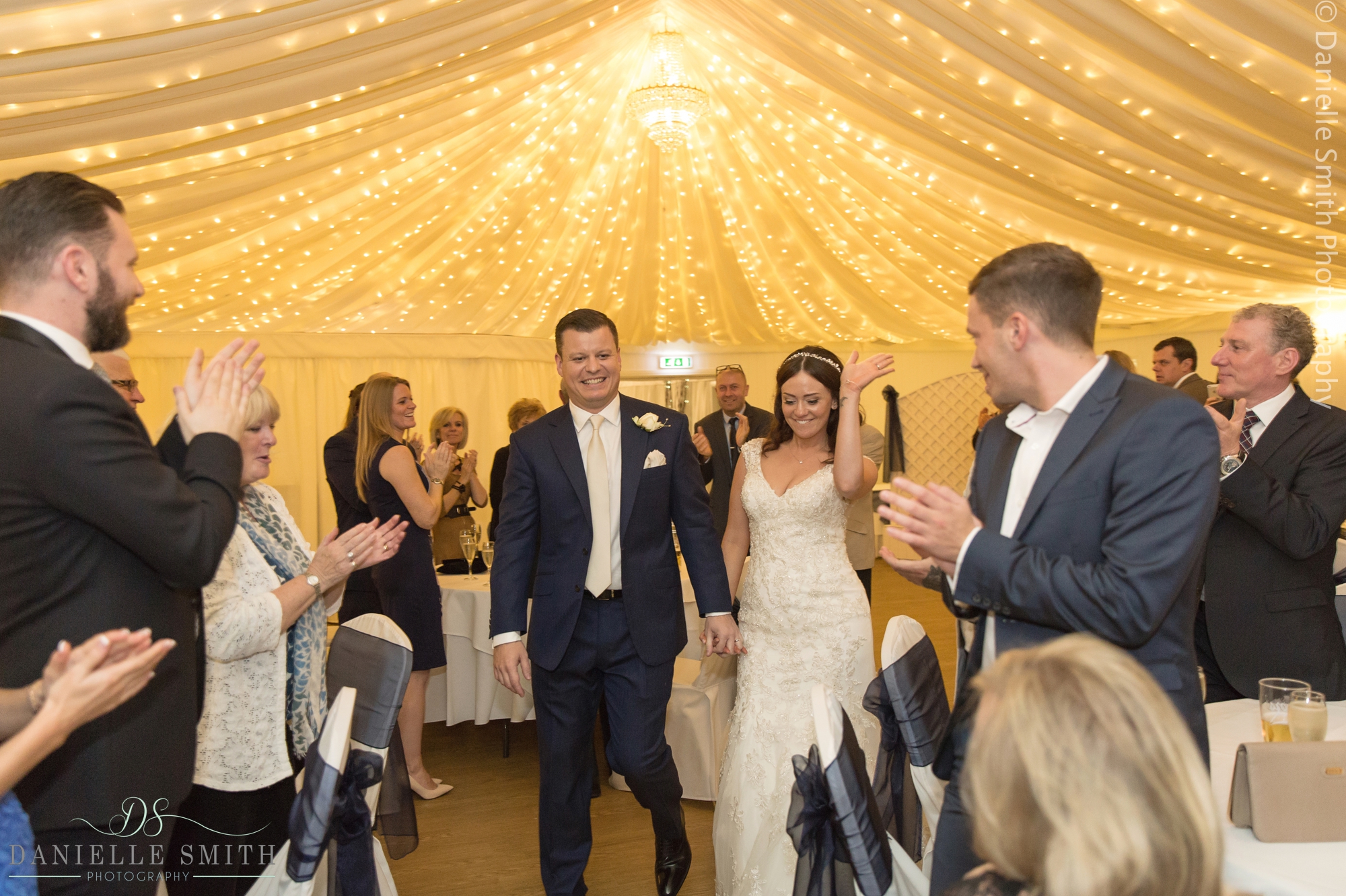bride and groom enter reception room - fennes intimate wedding