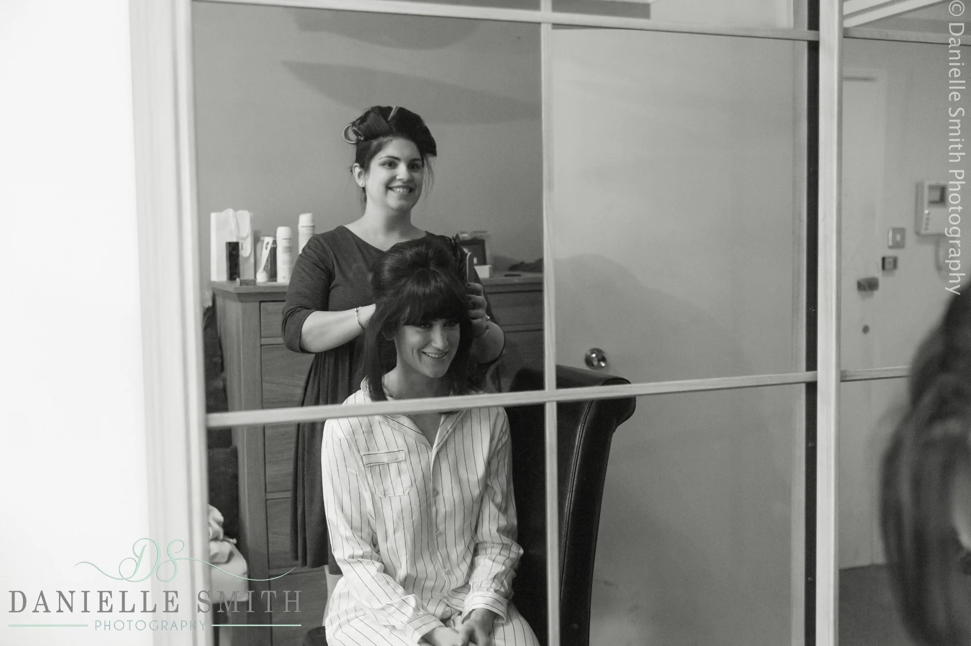 reflection of bride getting ready in mirror