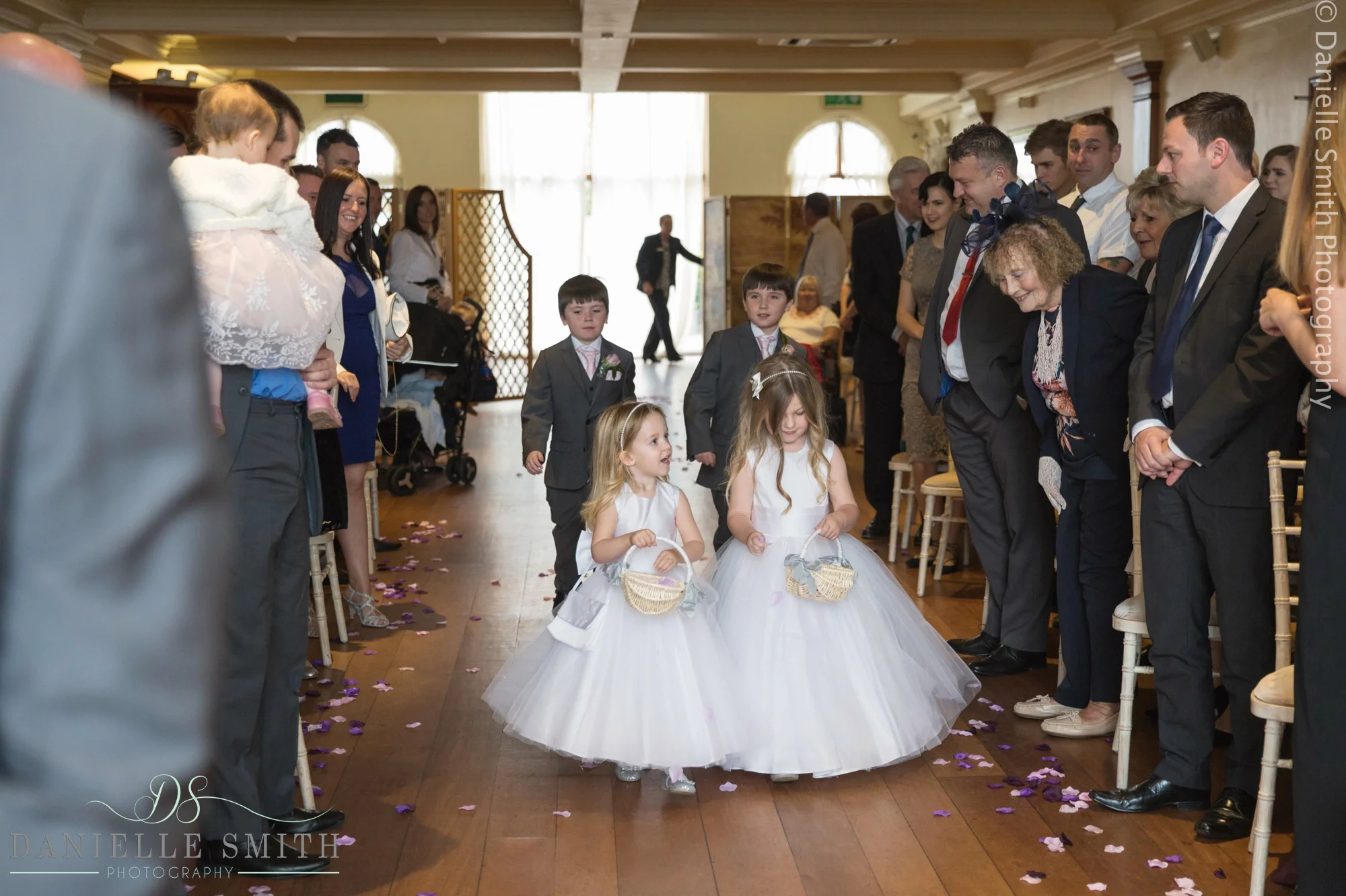 flower girls and page boys walking down aislebrdie and dad walking down aisle - 1920s style wedding
