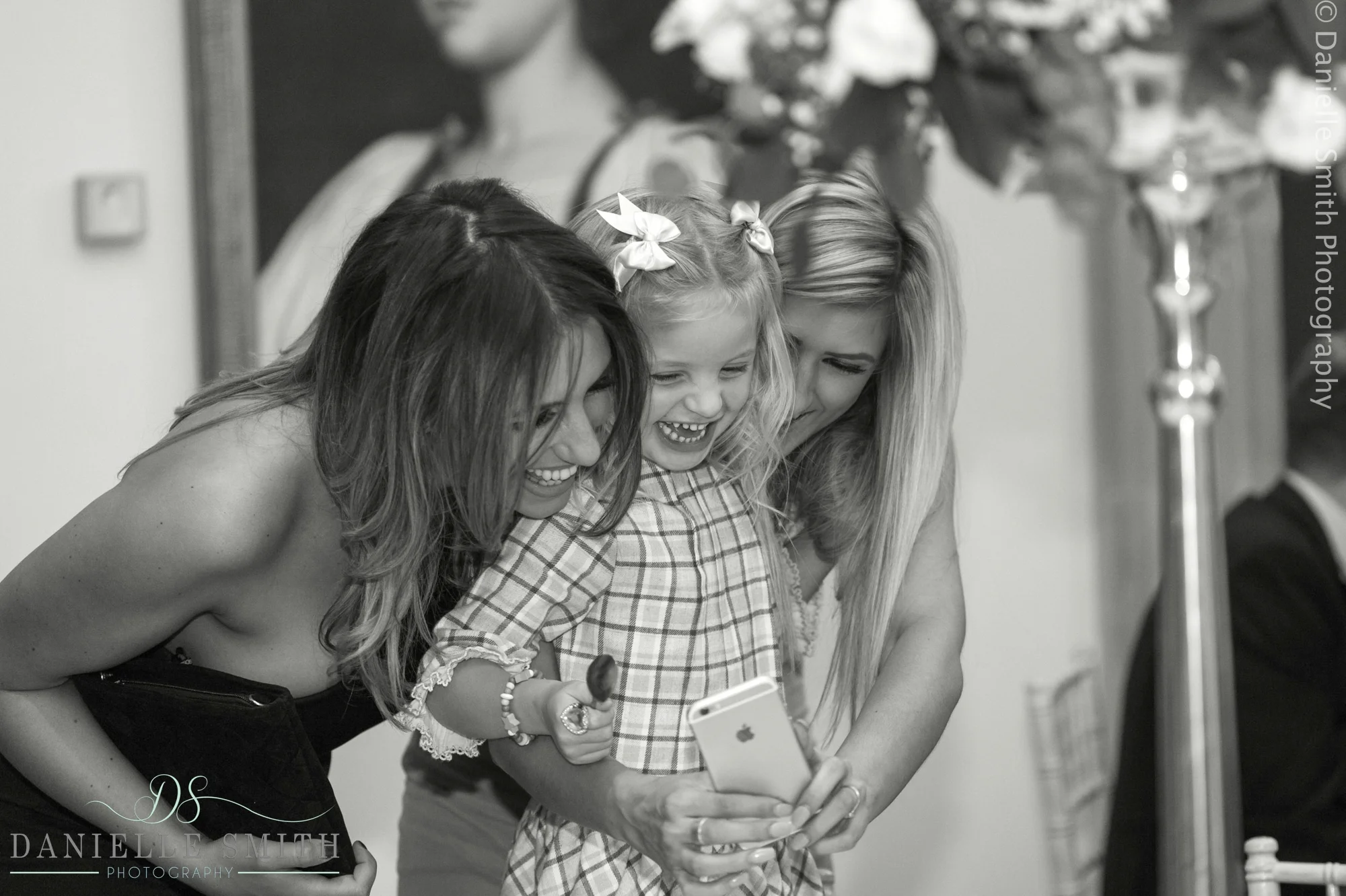 wedding guests and little girl having selfie