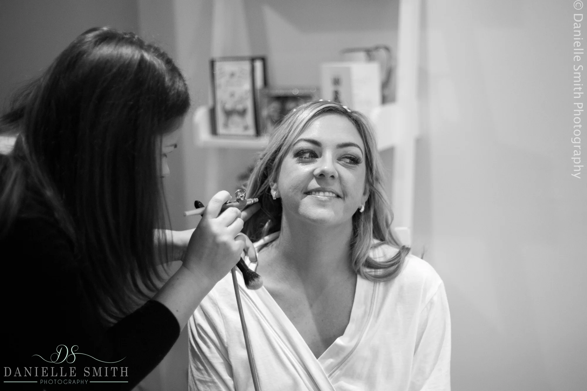bride having airbrush make up