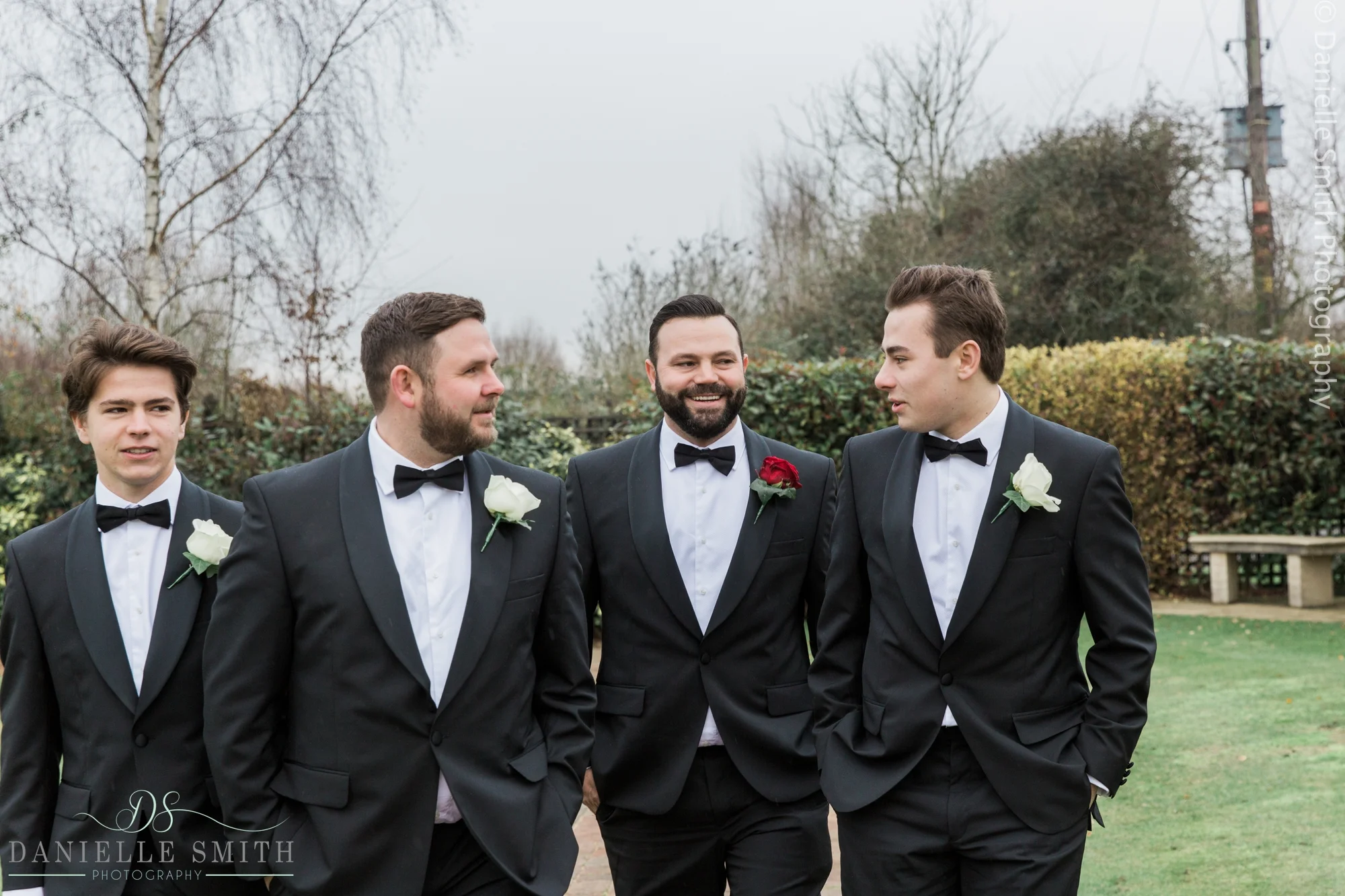 groom and groomsmen in black tuxedos - new years eve wedding