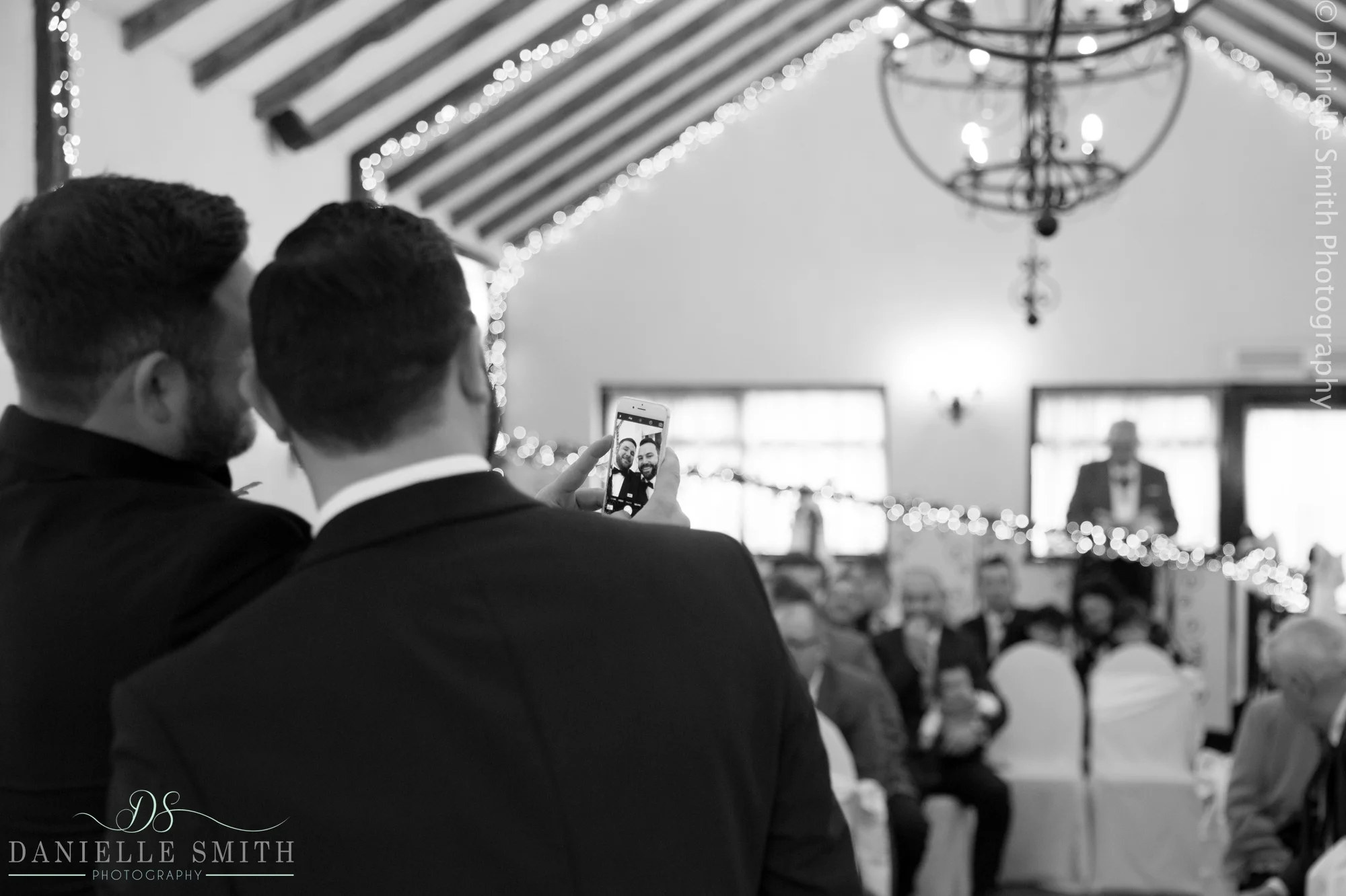 groom and best man having selfie