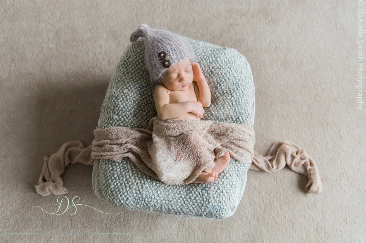 baby asleep in basket from overhead