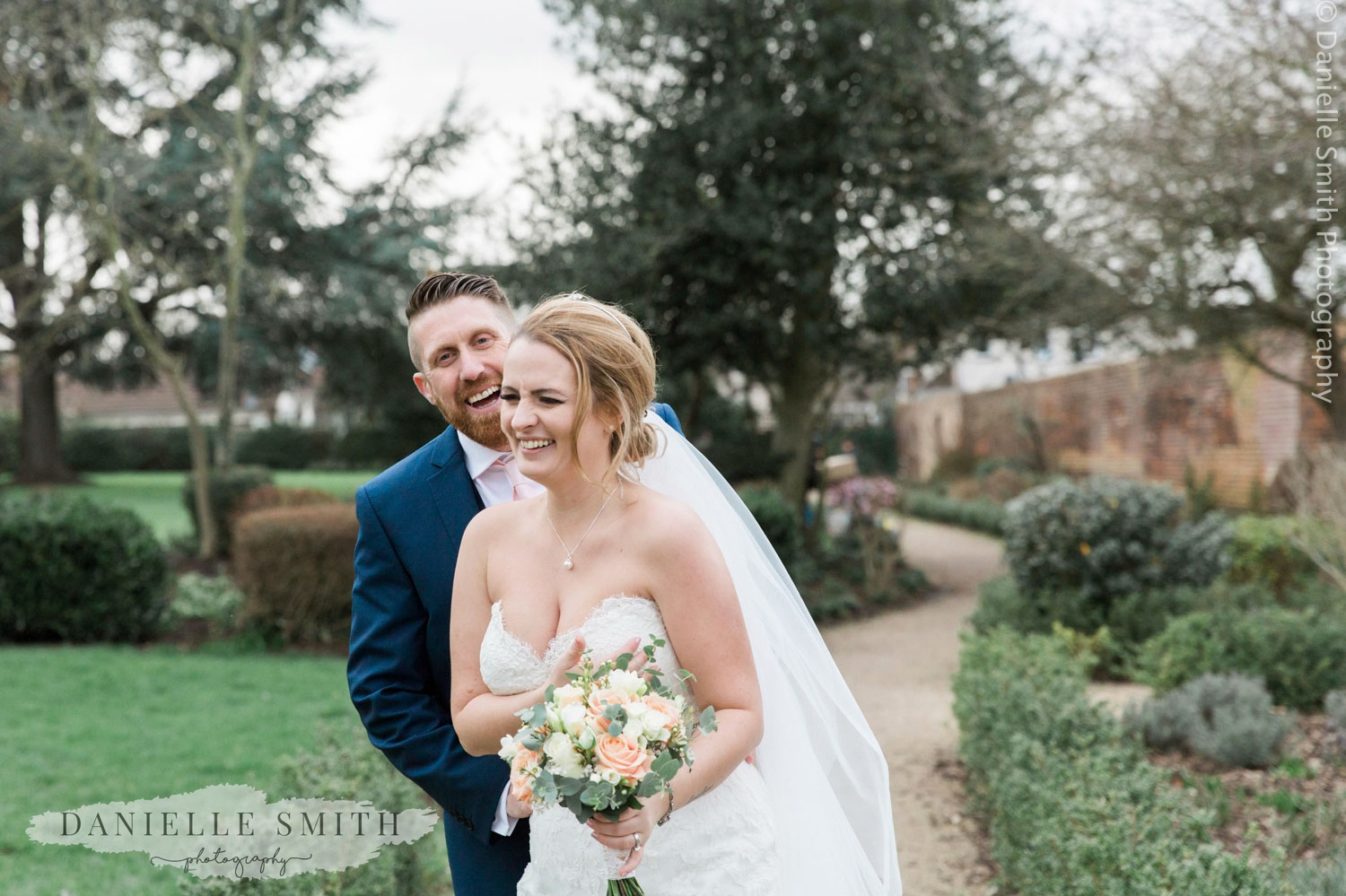 bride and groom laughing at spring wedding at langtons