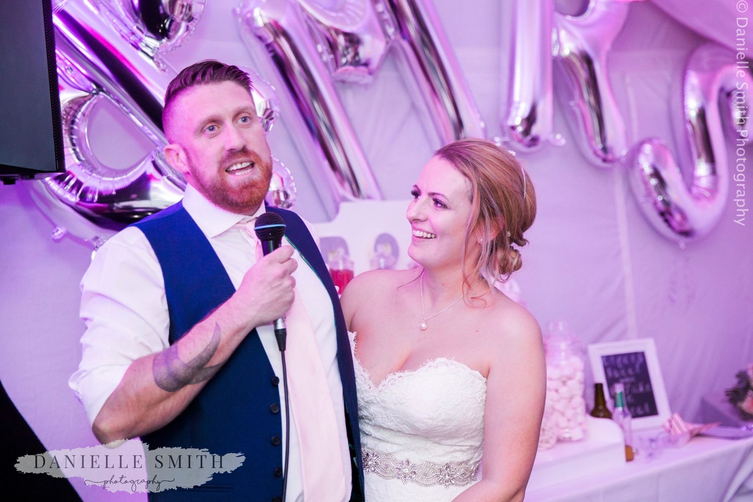 bride and groom giving speech