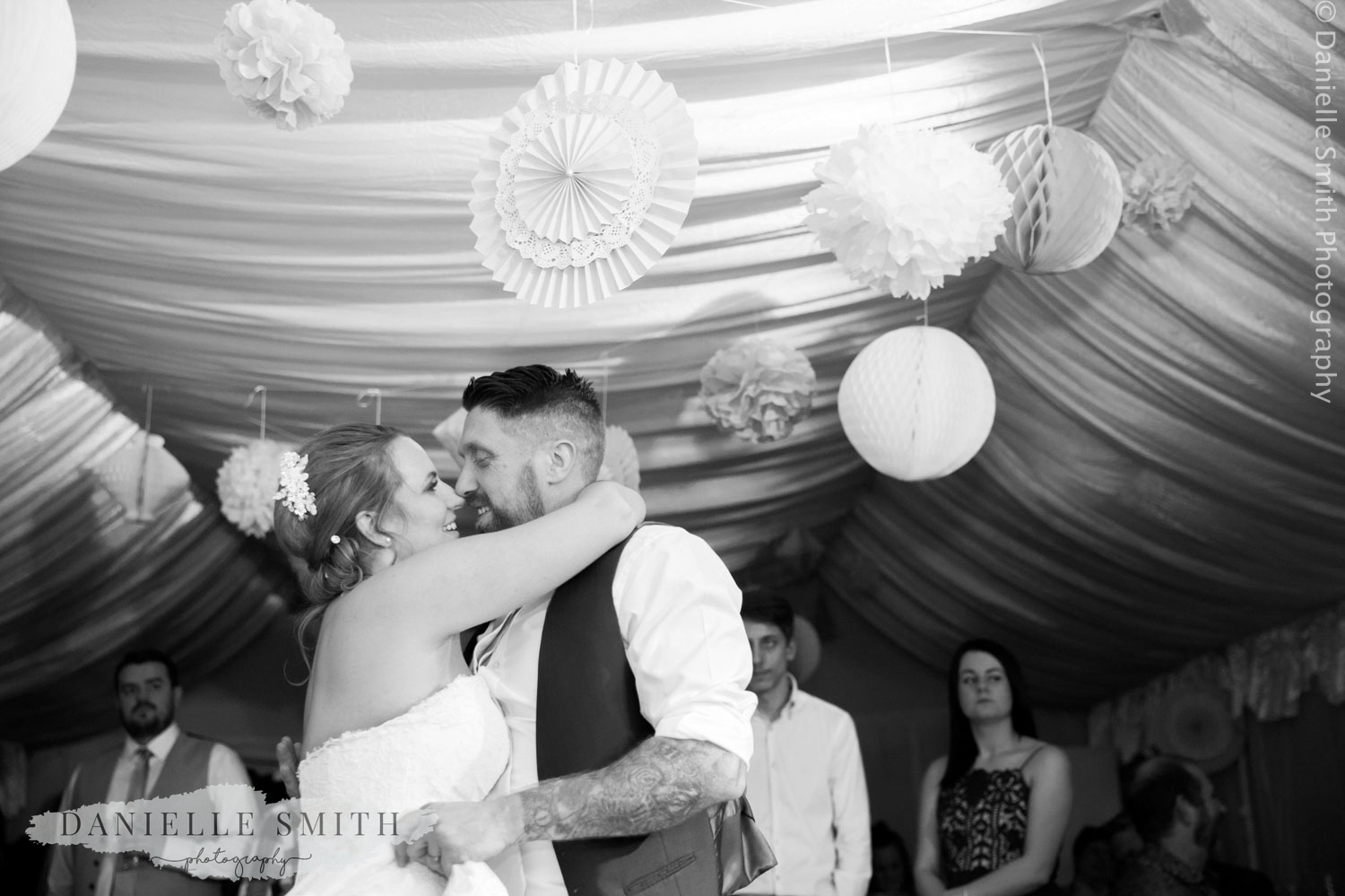 first dance with paper decorations - informal wedding at home