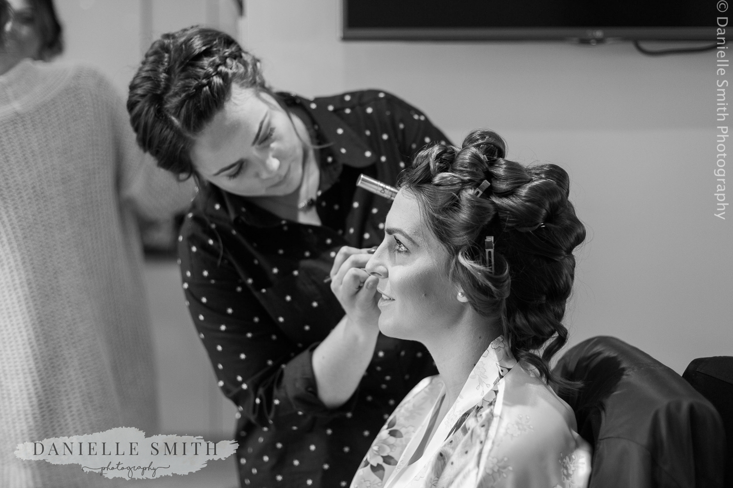bride having her make up done - ingatestone hall wedding