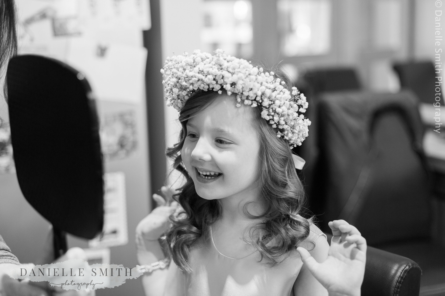 flower girl looking in the mirror