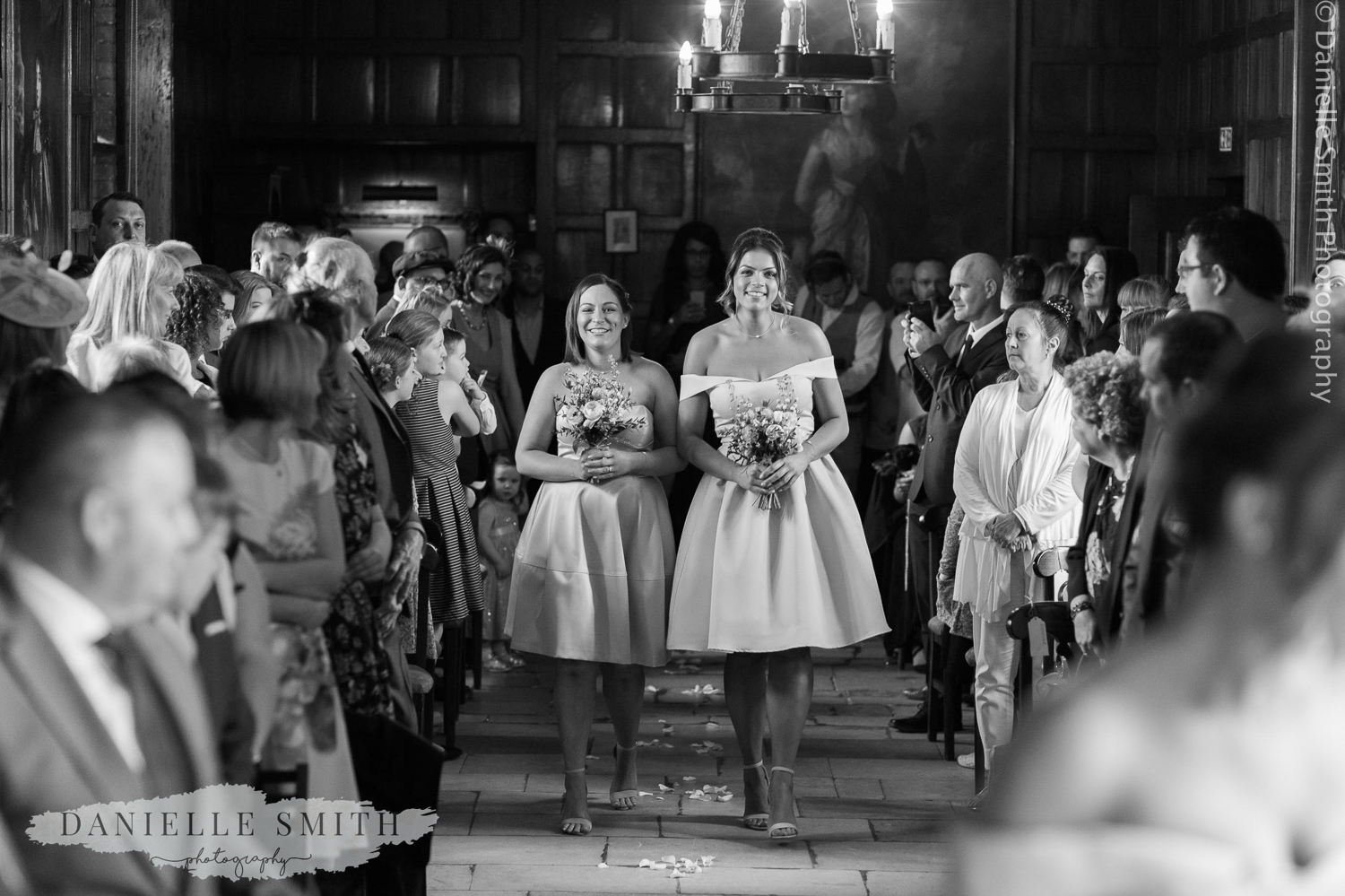 bridesmaids walking down the aisle at ingatestone hall