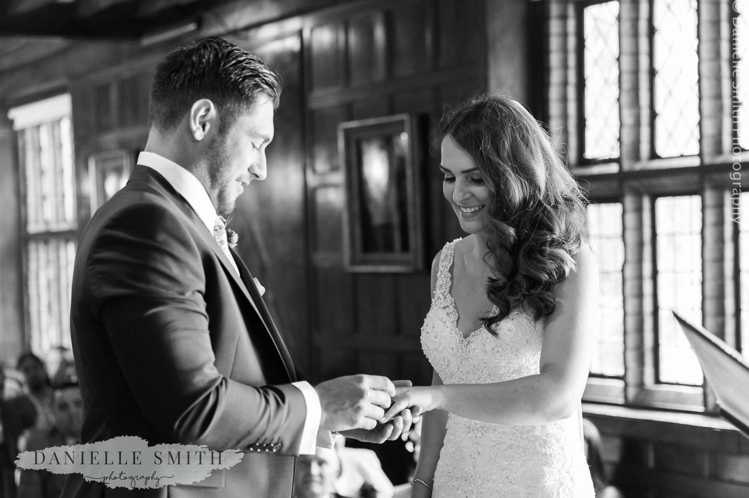 bride and groom exchanging rings