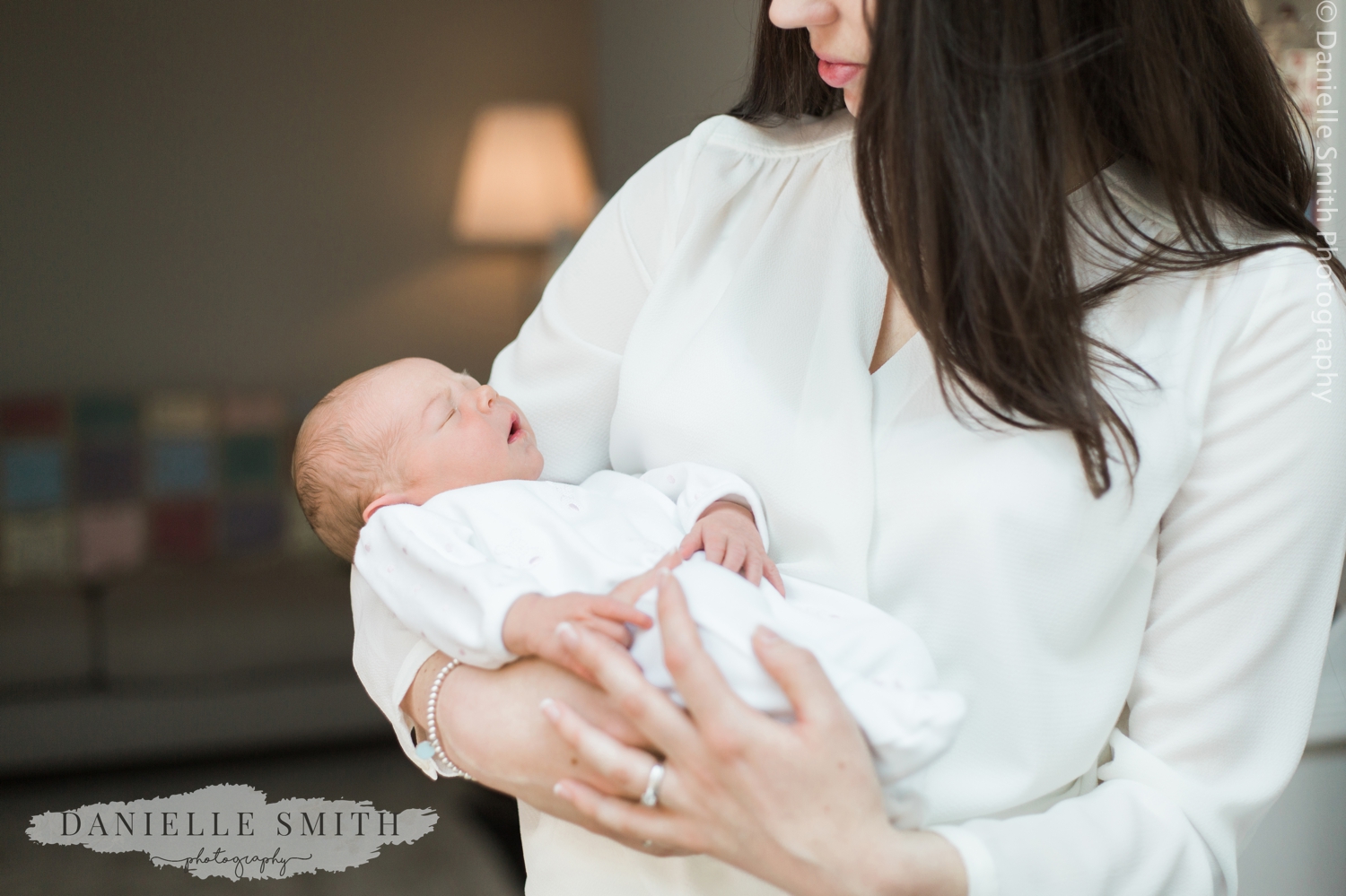 newborn baby in mums arms