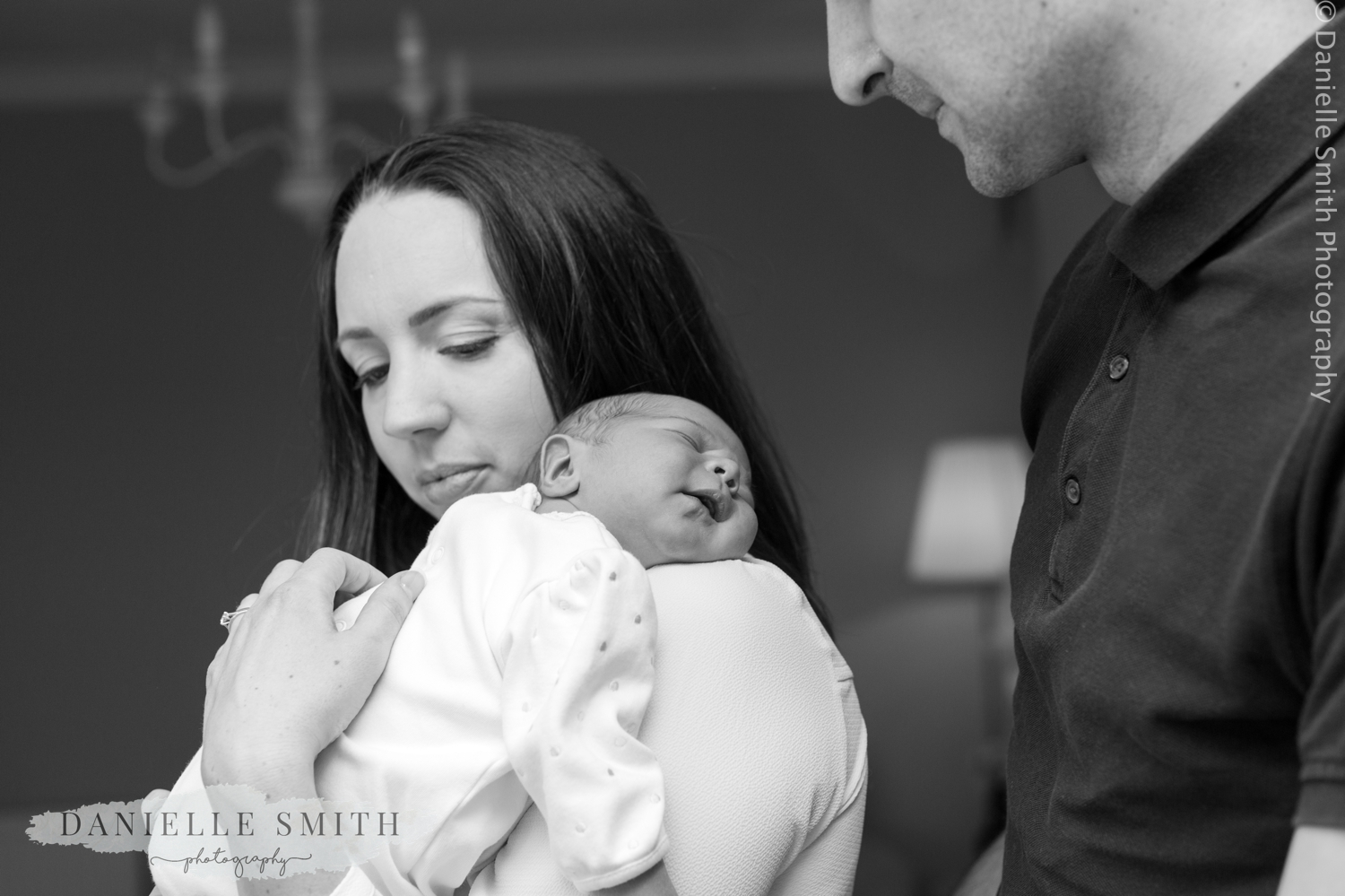 mum and dad with newborn baby - natural newborn photography
