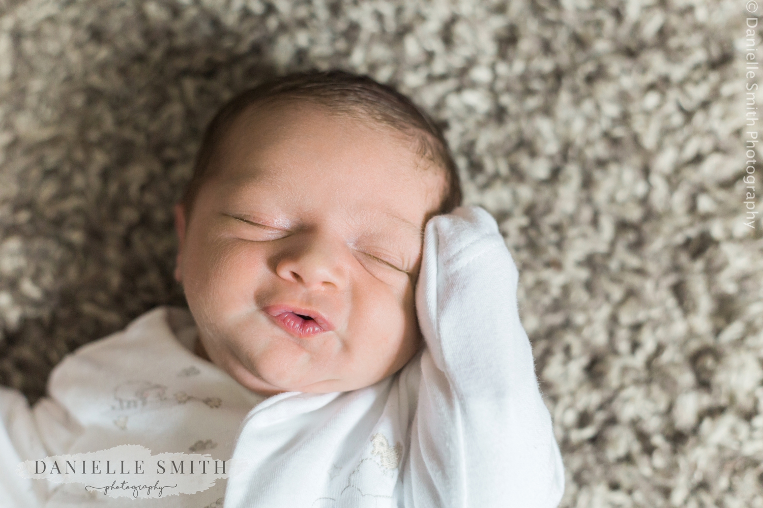 baby boys face - lifestyle newborn photography chelmsford
