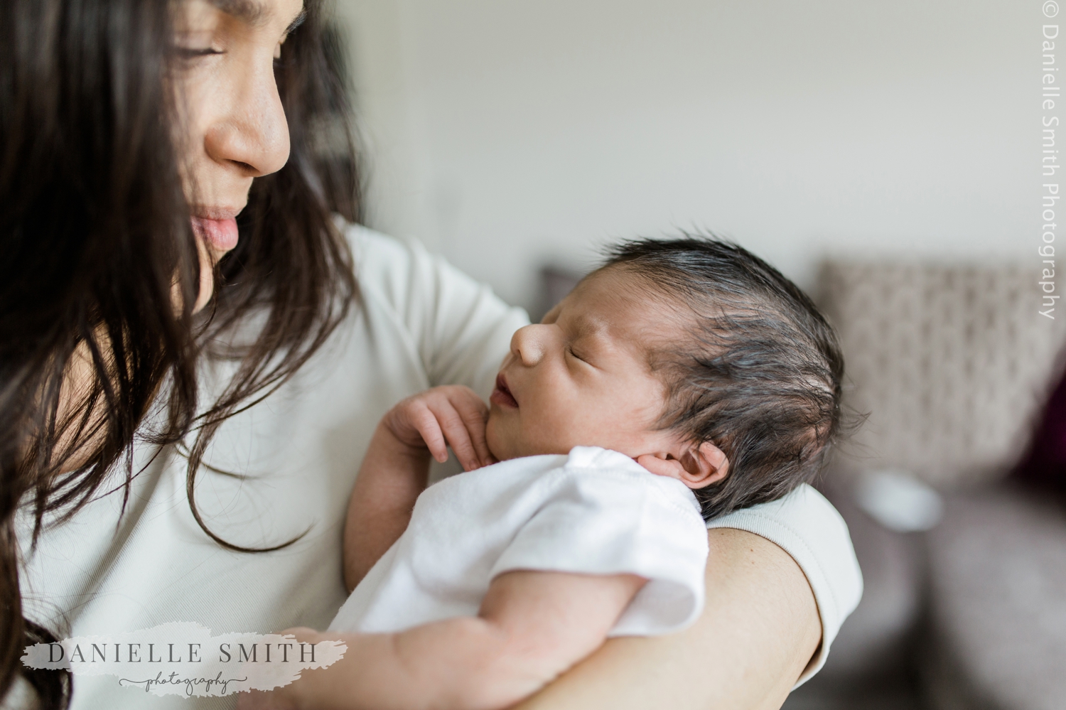 mum looking at her baby boy - newborn lifestyle photo shoot colchester
