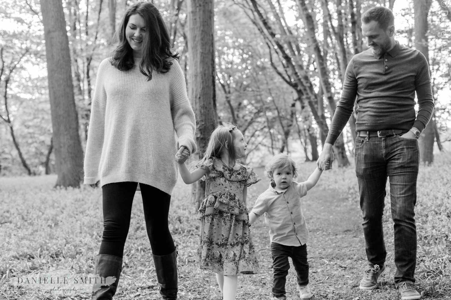 family walking through forest
