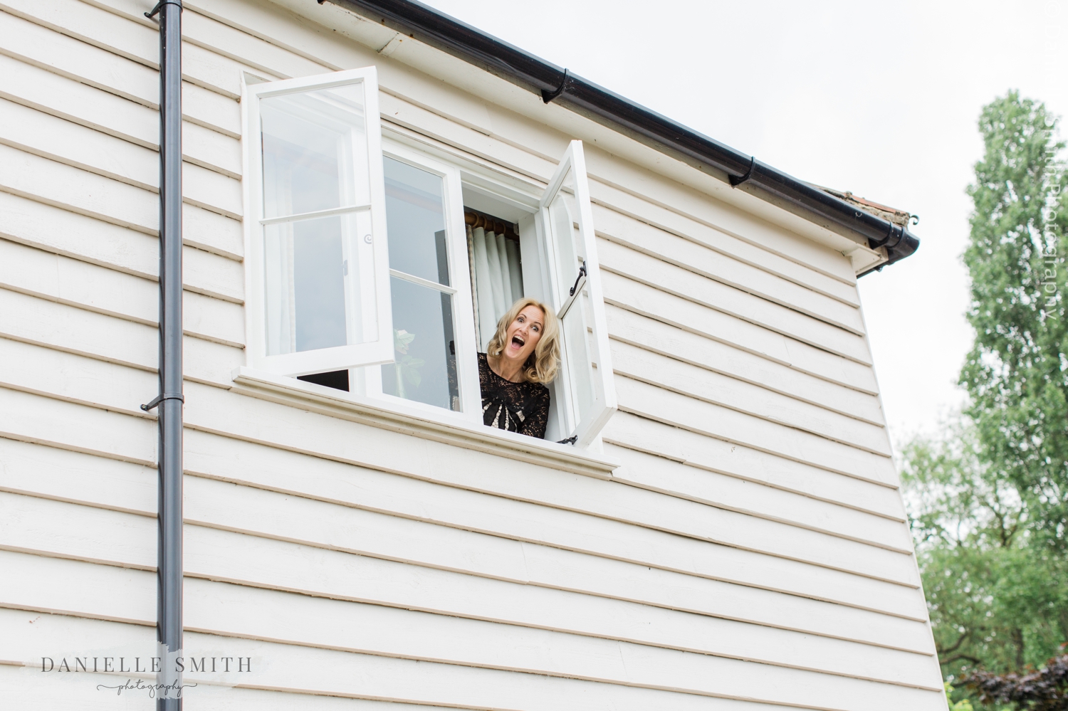 cutie popping her head out of the window