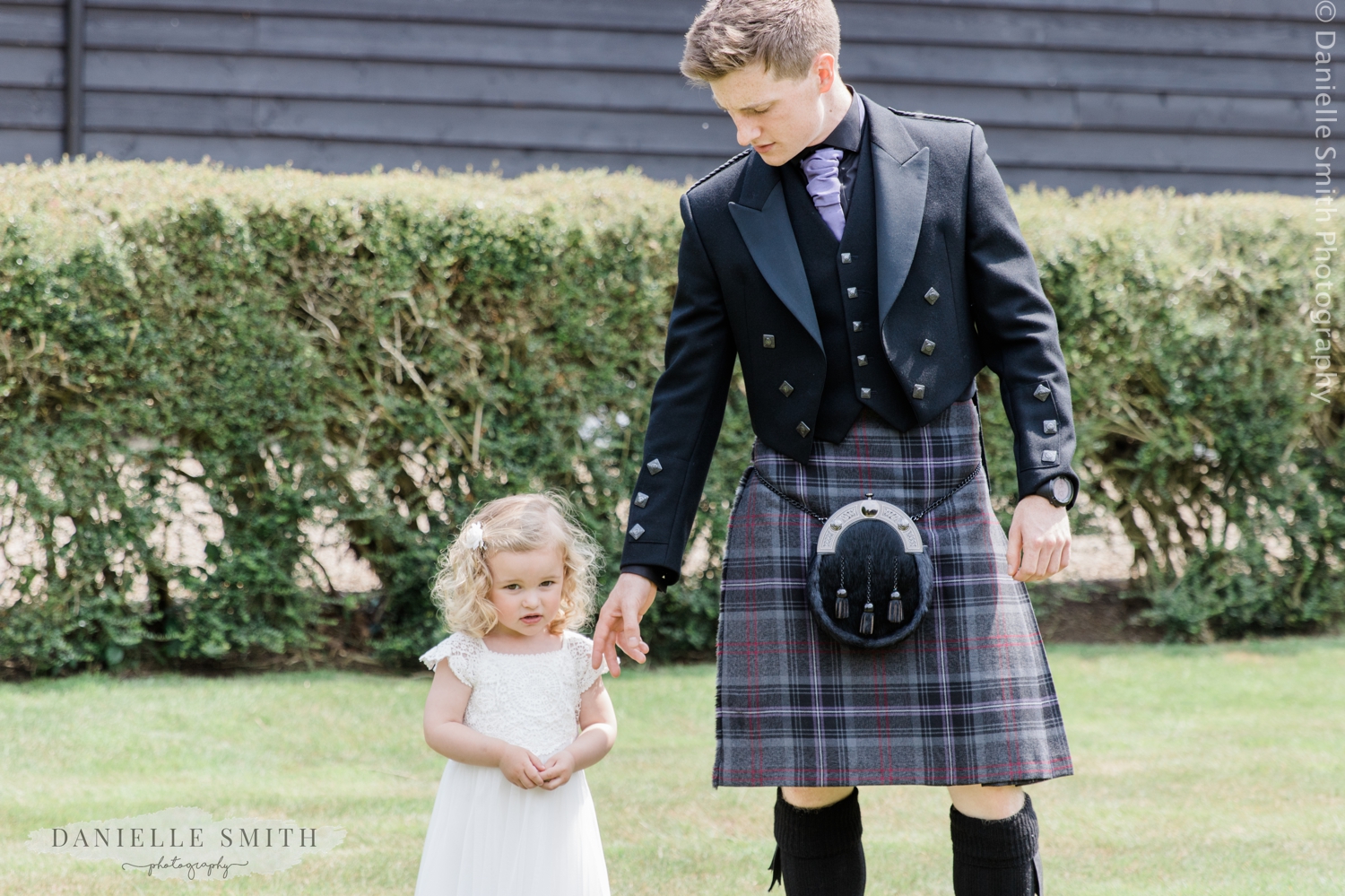 father in kilt with flower girl
