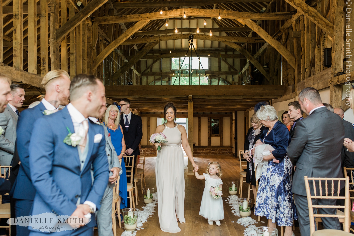 bridesmaid and flower girl walking down aisle - blake hall wedding