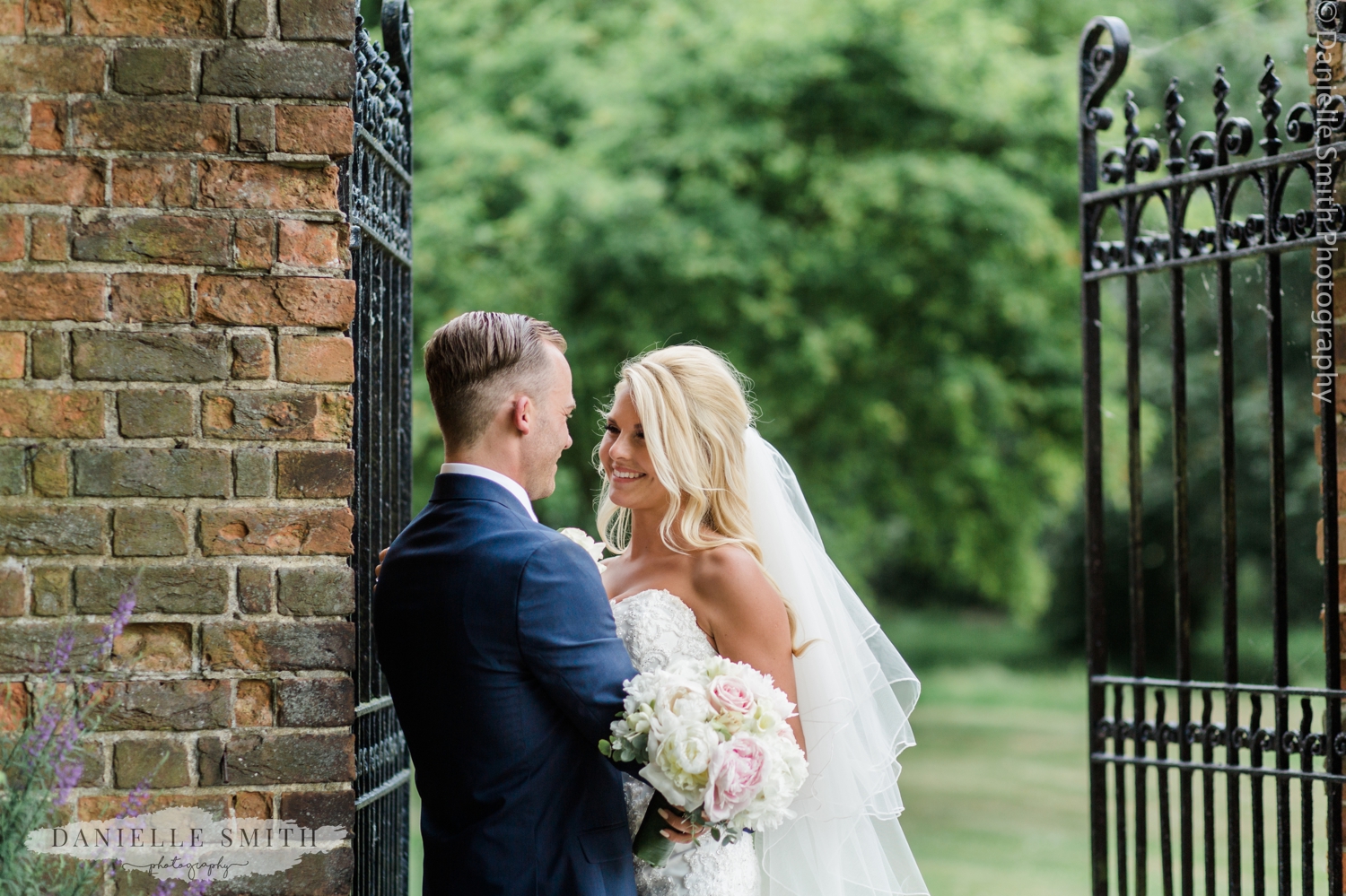 bride and groom portrait in gardens at blake hall