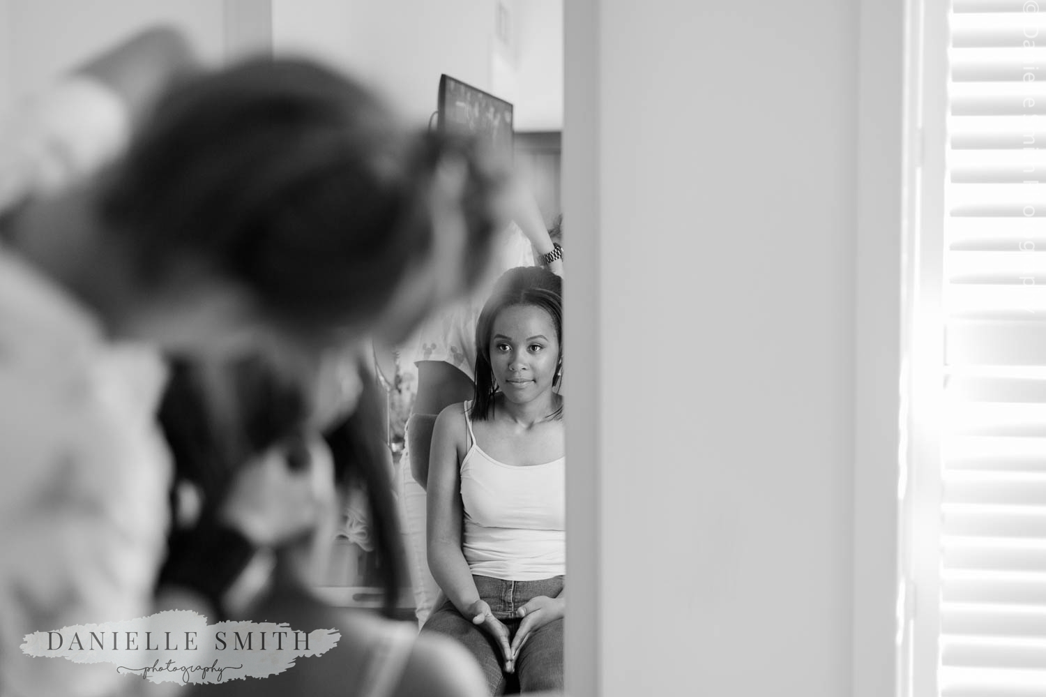 bridesmaid having her hair done